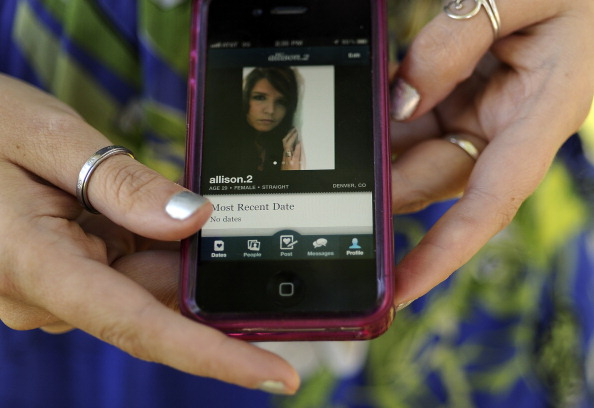 29-year-old Allison Silva uses the phone app HowAboutWe to meet people for dating. She was at an Aurora Park on Thursday, September 22, 2011. Cyrus McCrimmon, The Denver Post