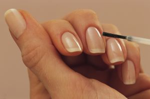 Woman applying nail polish