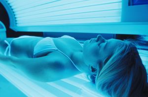 Woman using Tanning Bed
