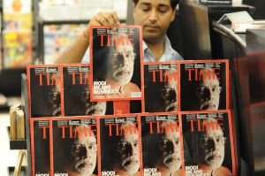 An Indian salesman arranges copies of Ti