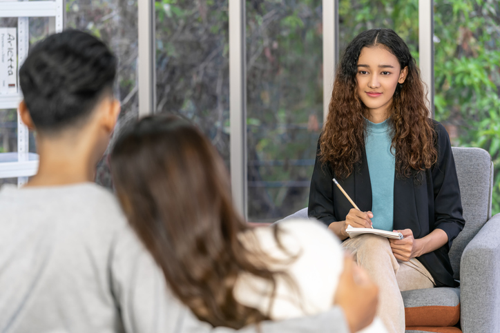Mental Health Professional smiling during psychologist therapy success