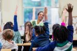 Teacher and students in elementary school classroom