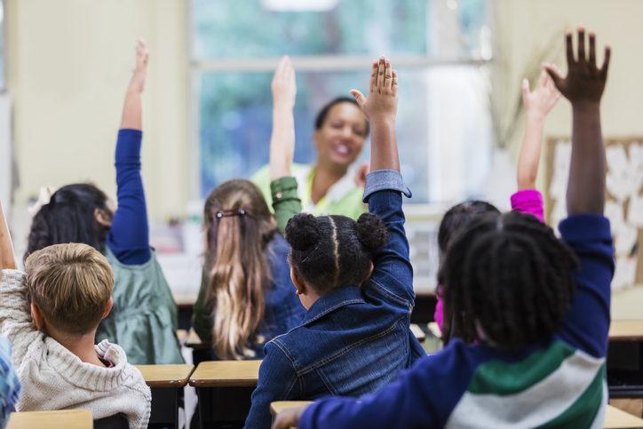Teacher and students in elementary school classroom