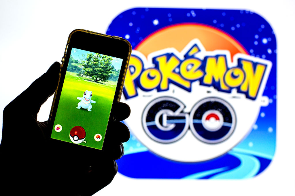 In this photo illustration a Pokémon GO app seen displayed...